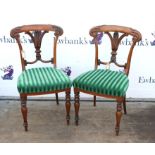 Pair of 19th century rosewood dining chairs with carved splat backs on turned supports,