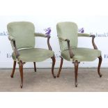 Set of six mahogany framed green upholstered open arm chairs with scroll arms on cabriole legs