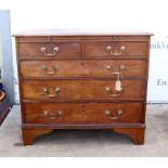 19th century mahogany chest of drawers with brushing slide over two short and three long graduated