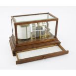 Oak cased barograph signed Negretti & Zambra, London on the brass bed plate, also fitted with a