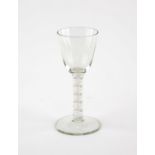 George III drinking glass with double cotton twist stem on spreading base, c1775,