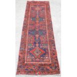 Iranian blue ground thick full pile runner, with four diamond medallions and stylised floral motifs