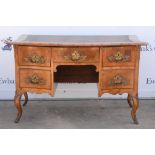 19th century Austrian walnut kneehole desk with serpentine front over five drawers on brass mounted