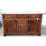 19th century oak dresser base with three drawers above cupboards and dummy drawers on square