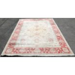 Pakistan cream ground carpet, with palmettes and scrolling foliage on a cream ground within a