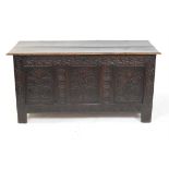 Late 18th/early 19th century oak coffer with three panels of carved floral decoration,