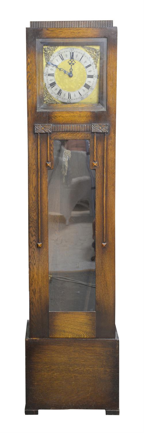 Art Deco oak longcase clock, three train movement chiming on eight rods, the square dial with Roman
