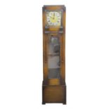 Art Deco oak longcase clock, three train movement chiming on eight rods, the square dial with Roman