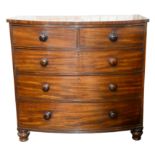 Victorian mahogany bowfront chest of two short over three long graduating drawers, on turned feet,