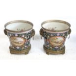 Pair of porcelain and gilt metal mounted jardinières with gilt metal rams head handles and painted