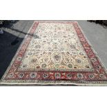 Large Persian carpet, signed to one end of main field, decorated with palmettes, scrolling foliage,