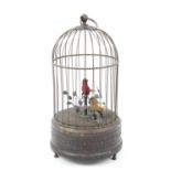 Singing bird automaton in gilt and white cage H23cm