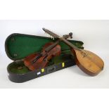 Vintage violin in ebonised case and with bow, back 37cm, together with a mandolin stamped 'The B