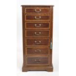 Early 20th century mahogany and satinwood banded Wellington Chest of seven graduated drawers on