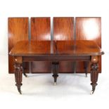 19th century mahogany extending dining table on turned and carved supports, with six extra leaves,