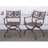 Set of eight cast metal garden armchairs, with basket weave design seats and scrolling floral and