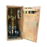 Late 19th/early 20th century J Swift and Son brass Microscope with assorted lenses and unused