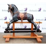 Modern black painted and dappled rocking horse, 137cm high,