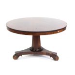 William IV mahogany tilt top breakfast table on octagonal column support to tri-form base scroll