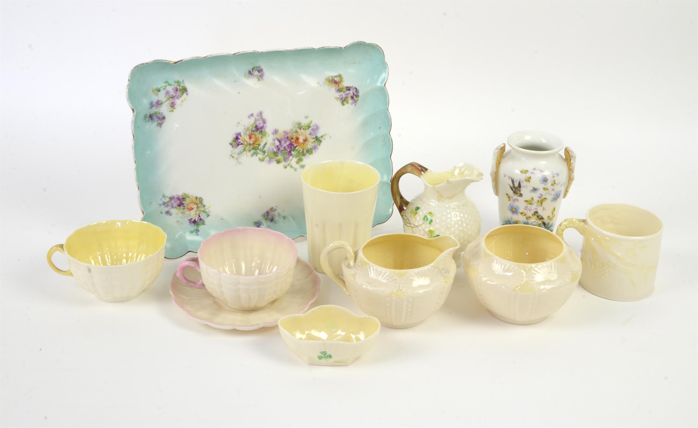 Nine pieces of Belleek porcelain and a Limoges tray and a porcelain vase, to include a Belleek cup