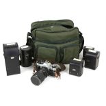 Cannon AE1 body together with various lenses, in bag