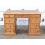 20th century pine pedestal desk, with three drawers over an arrangement of six drawers,