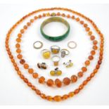 A group costume jewellery, including copal bead necklaces, a silver amber ring, size O 1/2,