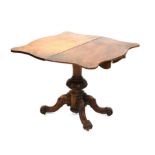 19th century walnut foldover tea table, on turned and carved support and quatrefoil base and
