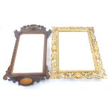 Florentine style giltwood and gesso wall mirror, with pierced scrolling floral and shell frame