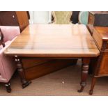 Late 19th century walnut extending dining table, on turned and reeded legs, with extra leaf,