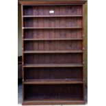 20th century mahogany and stained pine waterfall bookcase, the moulded top over six stained pine