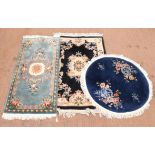 Three Chinese rugs, to include a turquoise ground rug with central floral medallion, 187 x 92.