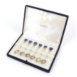 Cased set of six silver spoons each set with a Lapis lazuli finials