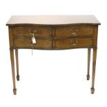 Early 20th century serpentine fronted cutlery chest, with four drawers on square tapering legs on