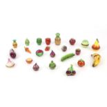 Twenty-three Liomges enamelled novelty boxes in the form of fruit and vegetables, to include banana,