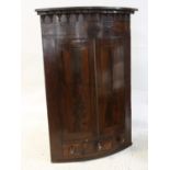 Victorian mahogany bow front corner cupboard two doors over a single drawer and 2 dummy drawers