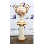 Two handled plaster Urn on pedestal stand painted with flowers signed Rehle on an ivory ground