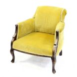 19th century low armchair with mustard colour upholstery on cabriole legs