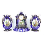 Porcelain mantel clock garniture architectural form two peasant women to front on a midnight blue