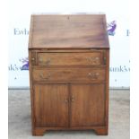 20th century mahogany bureau, the fall front over two drawers and two cupboard doors on bracket