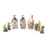 Chinese porcelain figurines of the Sanxing (Three Stars), red stamps and incised marks to bases,