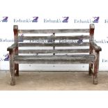 Weathered teak garden bench of slat construction on square legs, bearing plaque for Woodfurn,