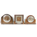 Two early to mid 20th century oak mantel clocks with Garrard three train movements, chiming,