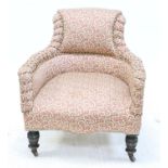 Victorian mahogany armchair floral upholstery turned legs to casters. h76cm x 71cm