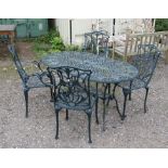 Green painted garden table, with pierced scrolling floral design, with pierced under tier on