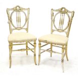 Pair of early 20th century gilt and white boudoir chairs