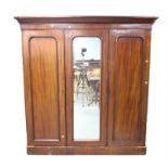 Victorian mahogany wardrobe with panelled and mirrored doors, enclosing hanging section,