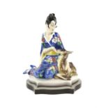 Large Goldscheider figure of a girl in a kimono seated with a fawn at her side, impressed mark