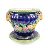 Minton majolica jardiniere with twin goat handles and floral swags on a dark blue ground,