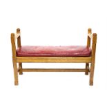 Late 19th century oak hall bench with associated red leather cushion, h72cm w107cm d39cm